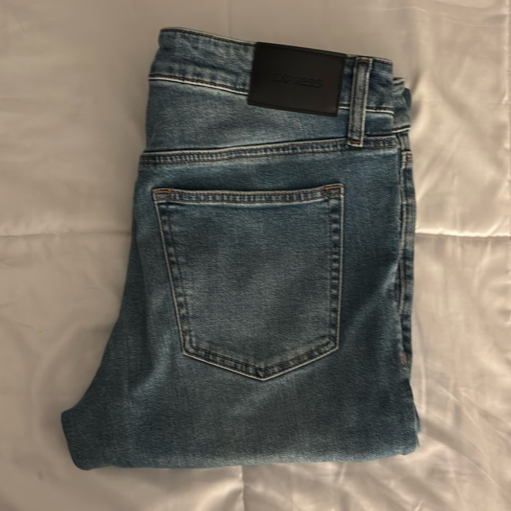 One pair of blue denim jeans.